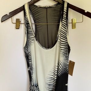 Racer back black and white dress higher in front hem, accent at wrist size XS
